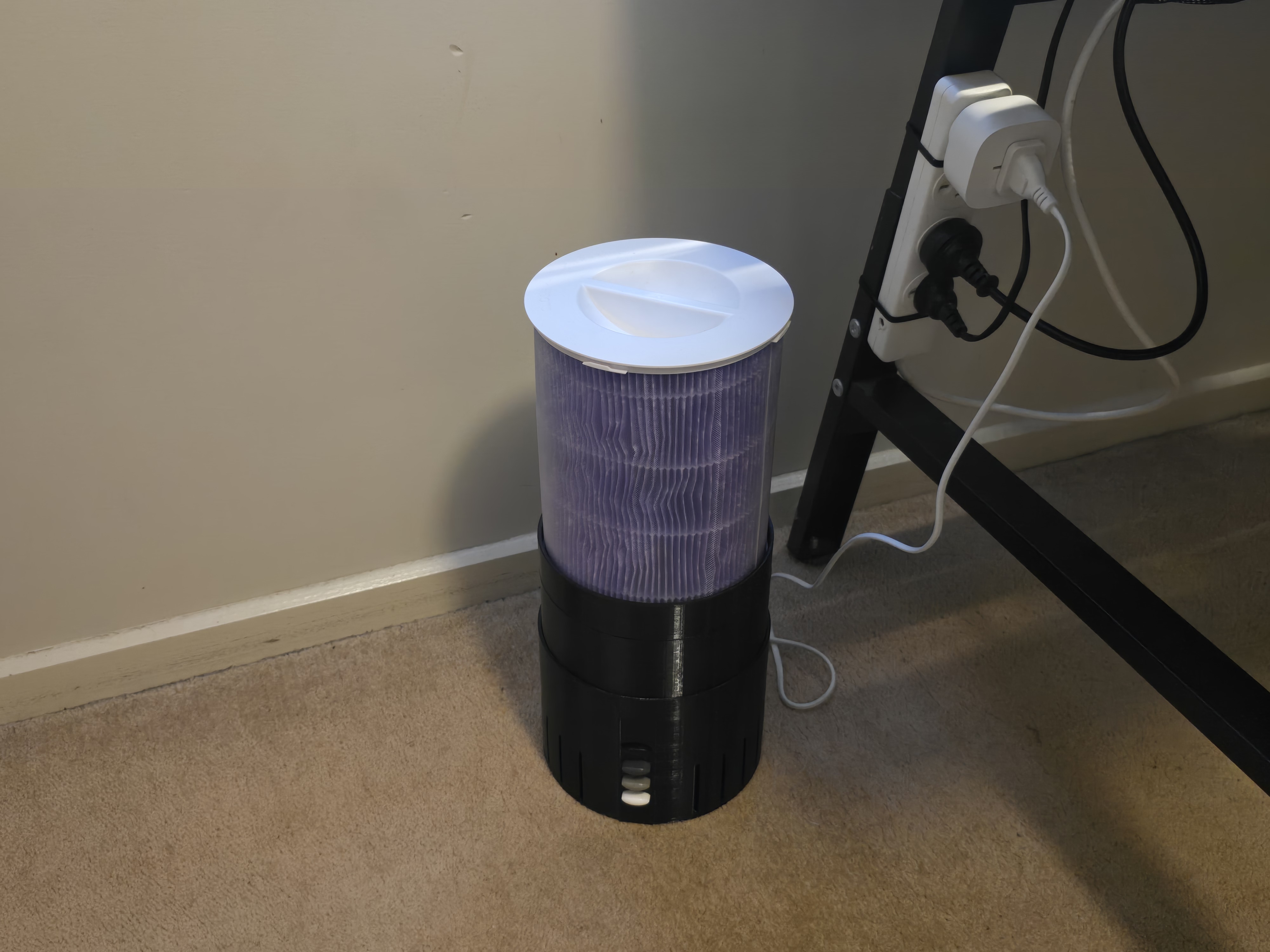 Finished homemade air purifier beside a power outlet