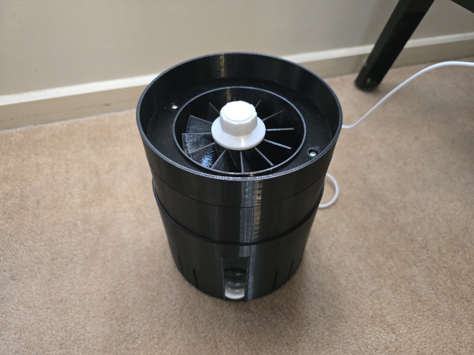 Air purifier with the filter removed, showing the impeller
